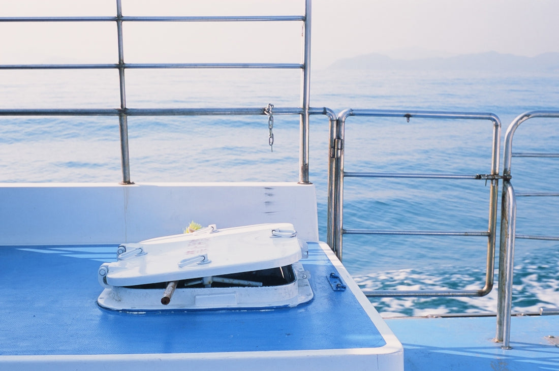 a white object is sitting on a blue boat