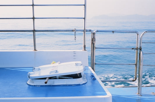 a white object is sitting on a blue boat