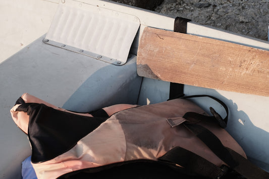 a bag sitting on the back of a boat