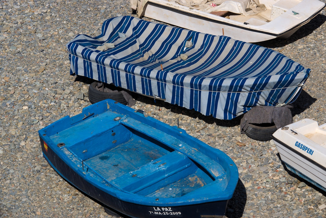 A group of small boats sitting on top of a beach
